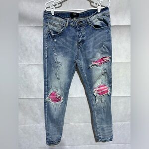 AMIRI Light Blue Skinny Jeans with Pink Patch Distress